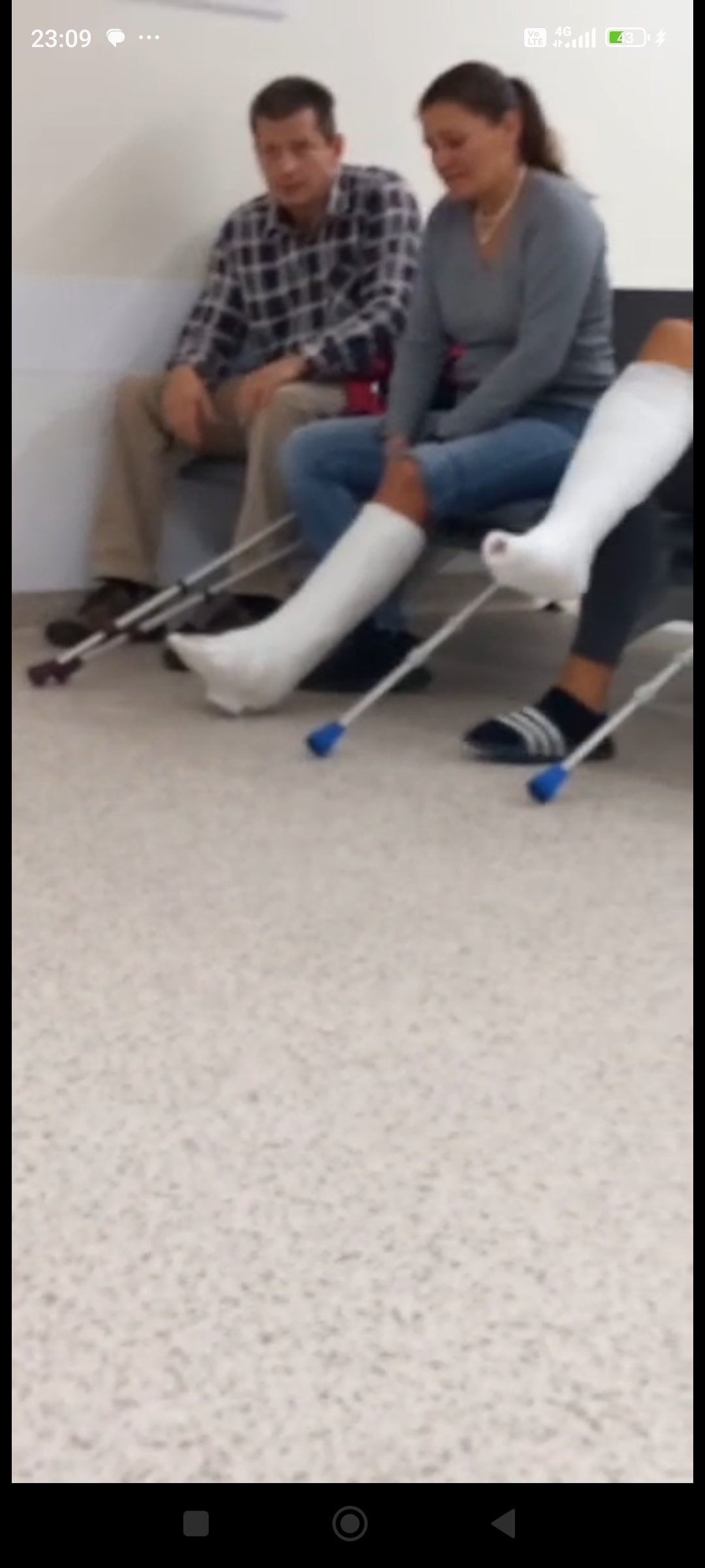 Woman slwc in front of castroom video